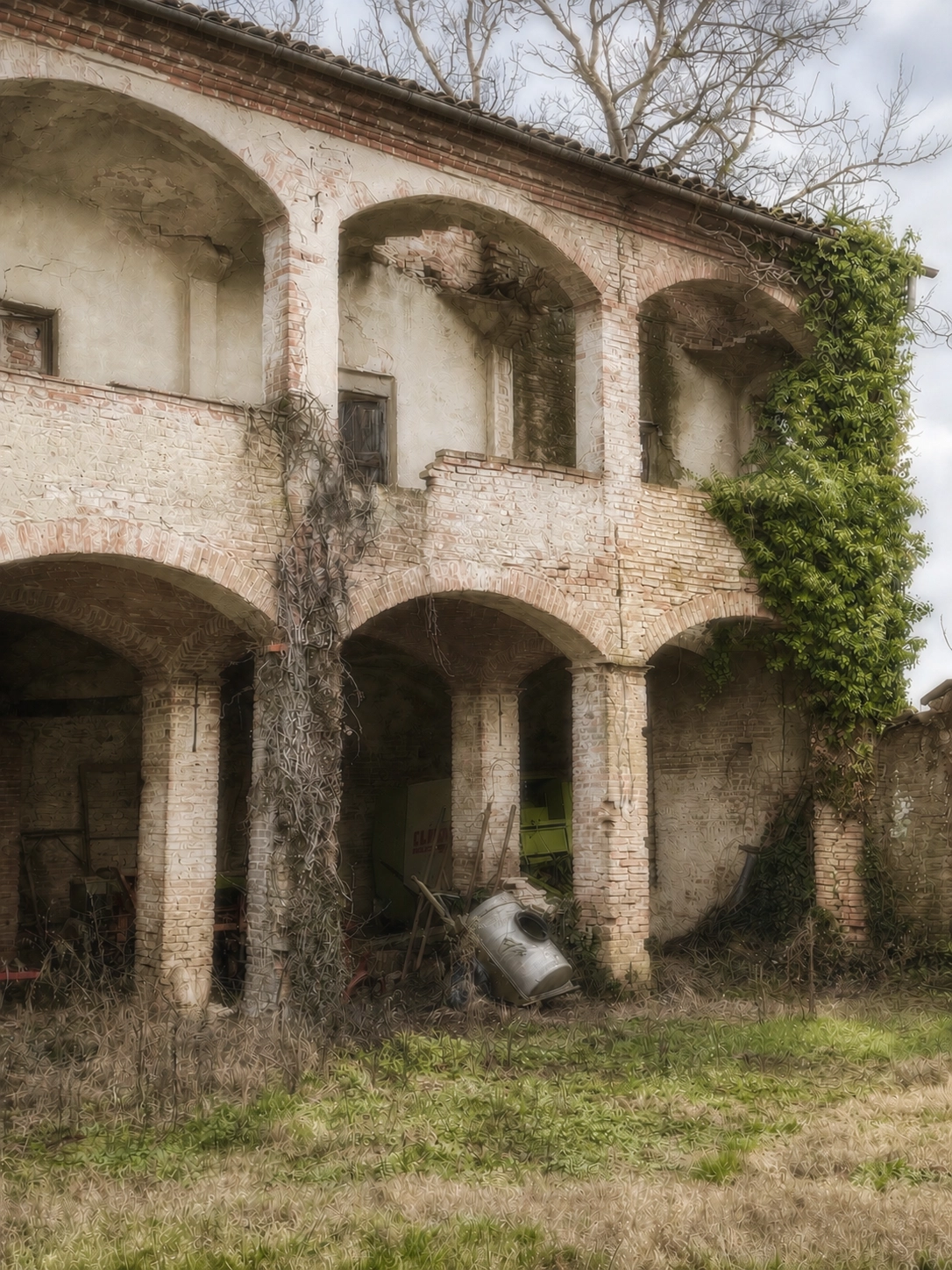 Historic Italian villa with arched colonnades and climbing ivy