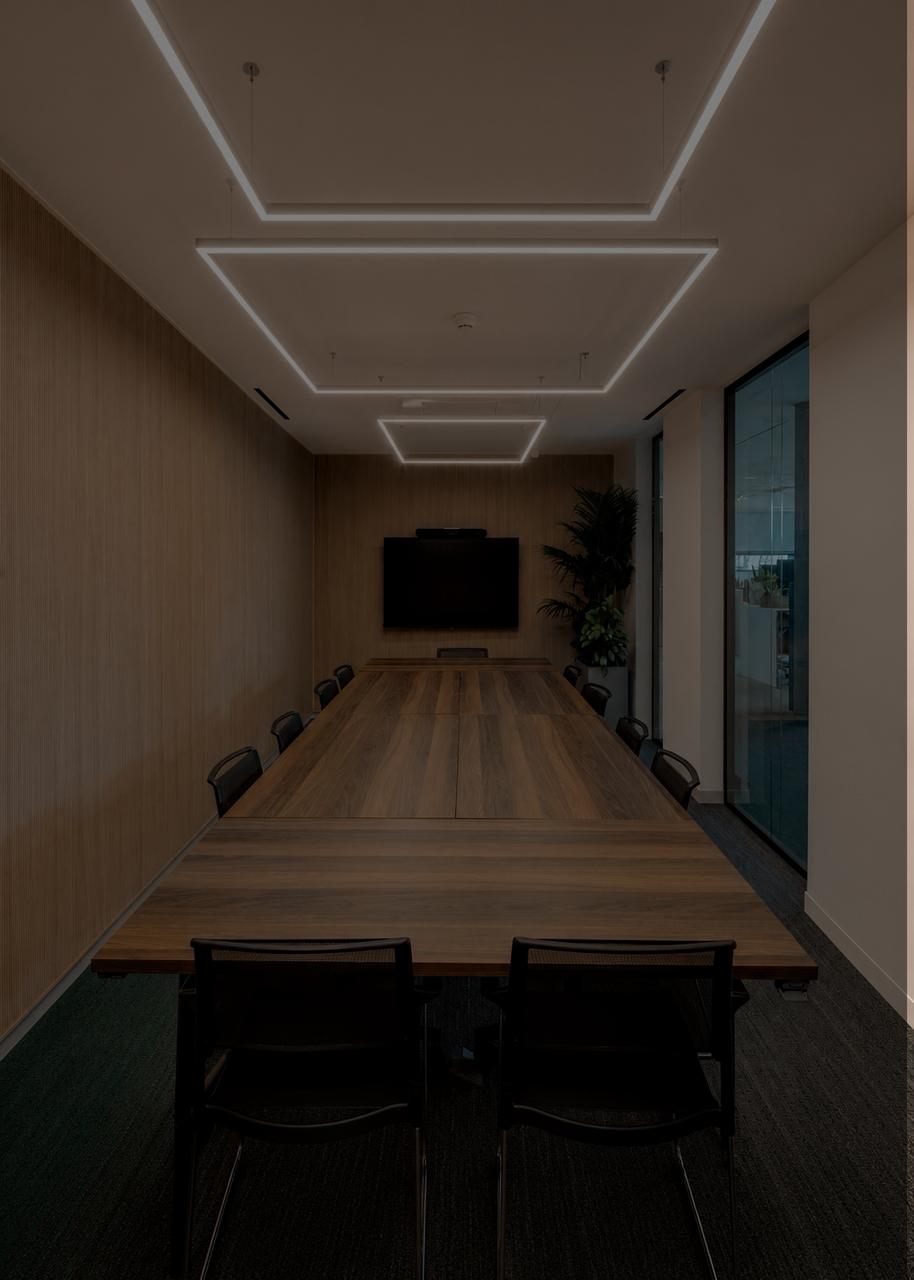 Contemporary boardroom with dark wood and glass