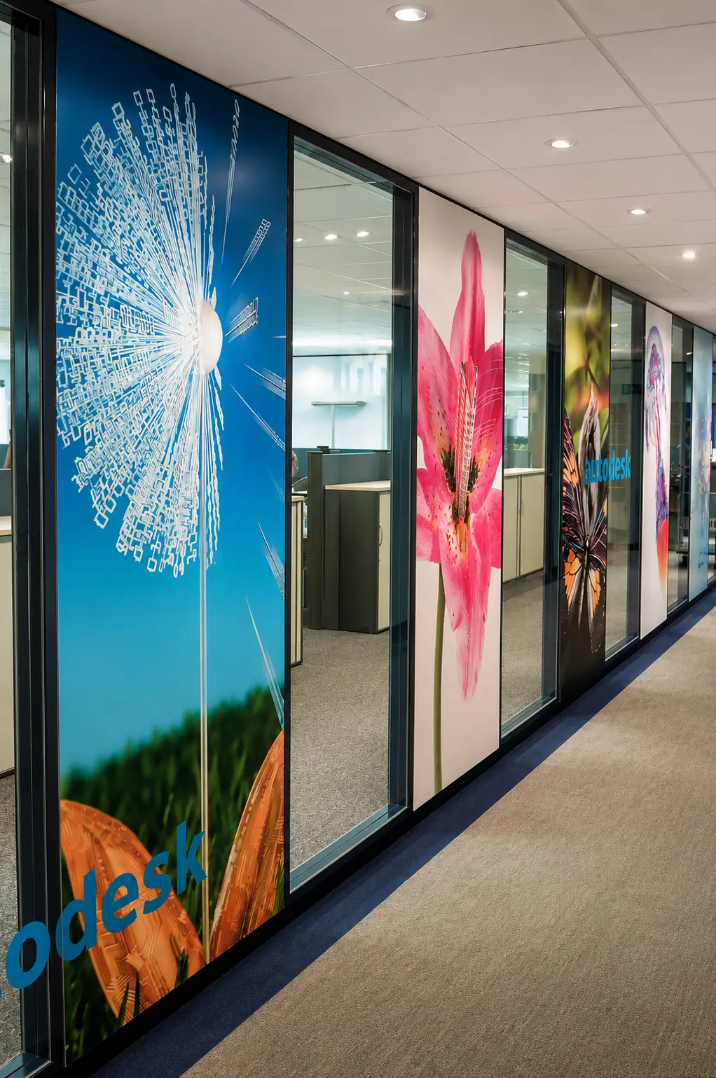 Third-floor circulation hall carrying the floral graphic rhythm through the workplace