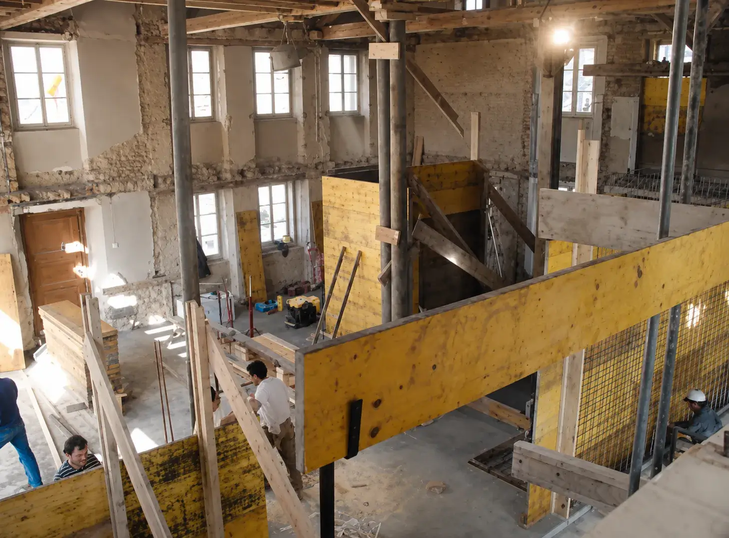 Construction within the gutted farmhouse shell at Blancpain