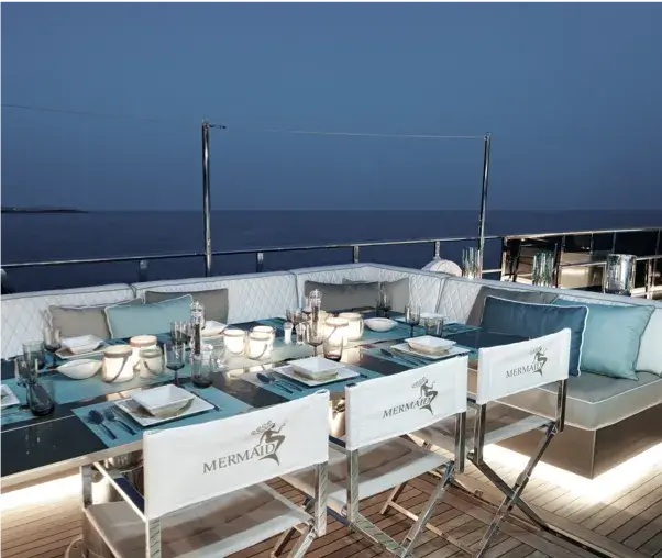 Evening dinner setting on deck aboard M/Y Mermaid