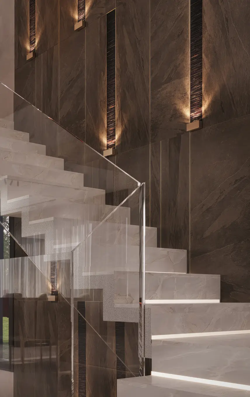 Villa D staircase detail — a close view of the floating stone treads and glass balustrade against the illuminated dark stone wall