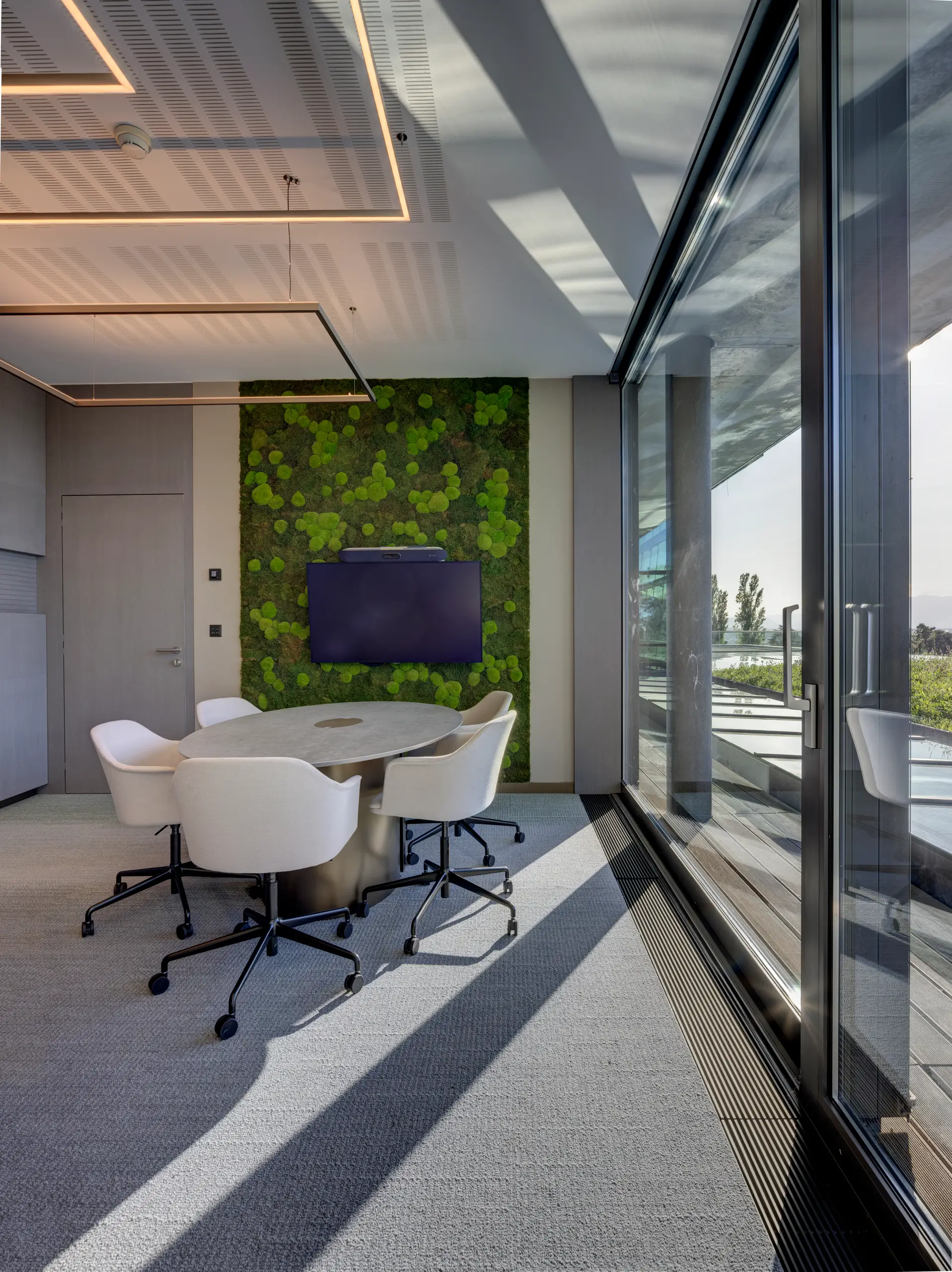 Meeting room framed in timber with daylight and garden views