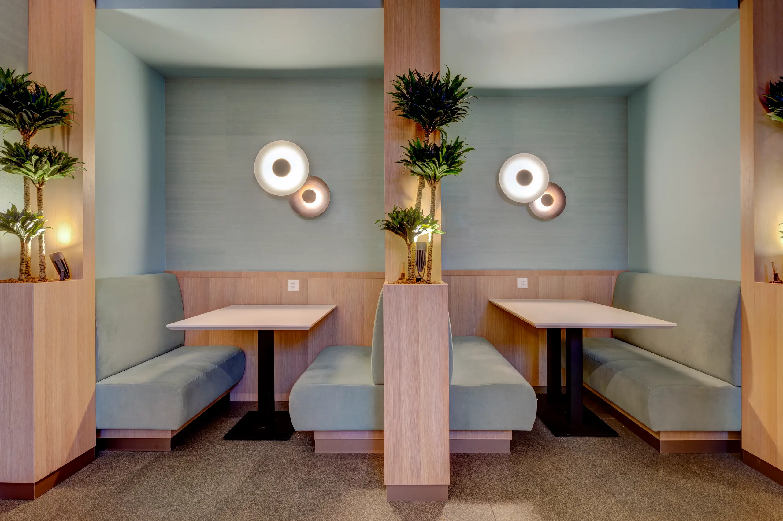 Bistro setting with banquettes and warm lighting for conversation and collaboration